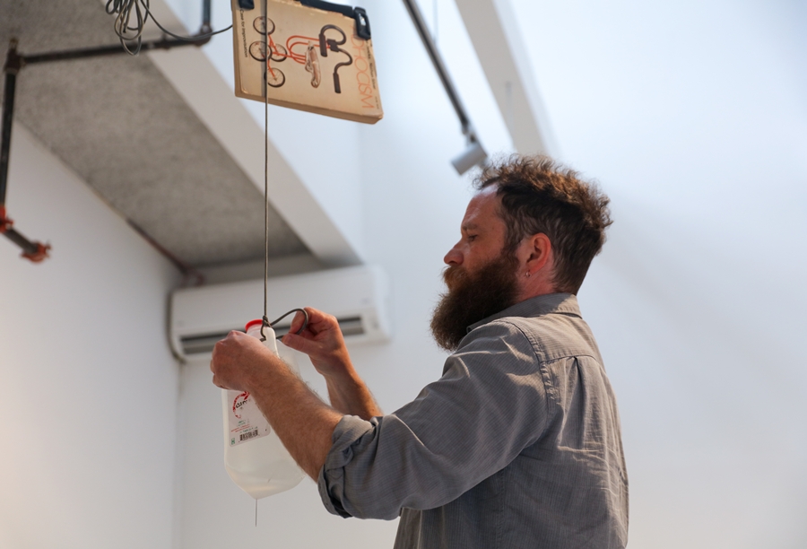 Visual Arts Fellow Jeff Gibbons installing work in the gallery